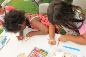 Two elementary-aged girls coloring