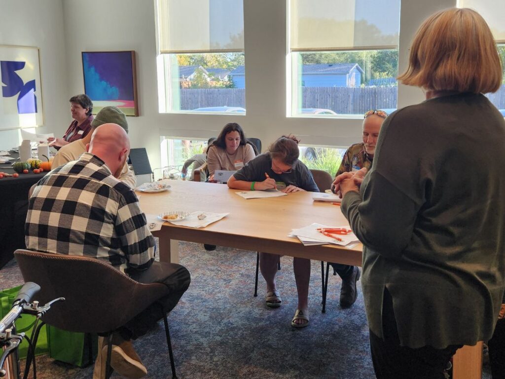 people attending a workshop at the fall financial fair