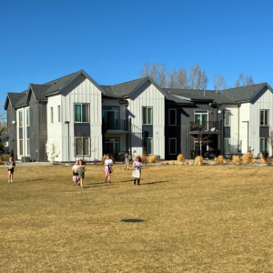 kids doing an egg hunt at village on horsetooth