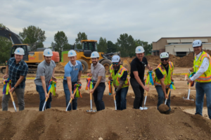 people posing at the village on eastbrook groundbreaking
